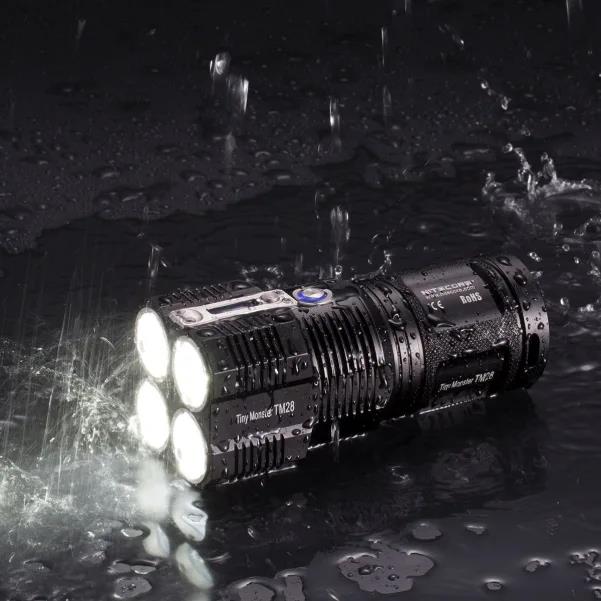 Nitecore gaismas lukturis TM28, 6000 lūmenu, 4 x IMR 18650 akumulatori, IPX-8, OLED displejs, statīvs, lādētājs