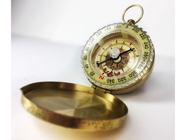 Compass with a cap, golden color